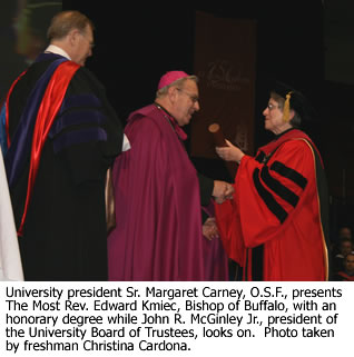 University president Sr. Margaret Carney, O.S.F., presents an honorary degree.