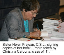 Sr. Prejean signing her book.