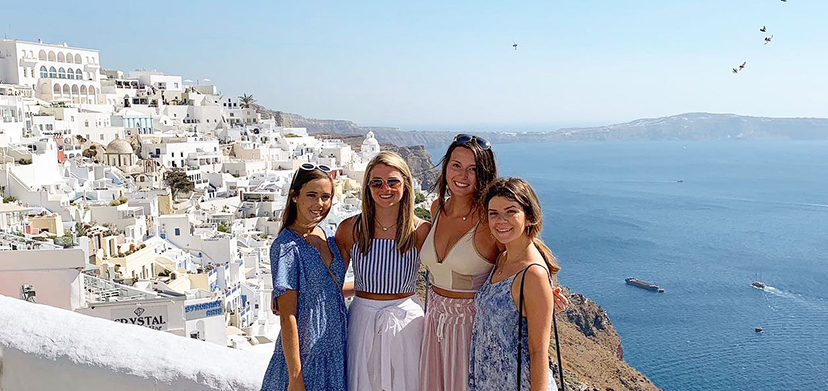 Four students on a coastal path overlooking Sorrento