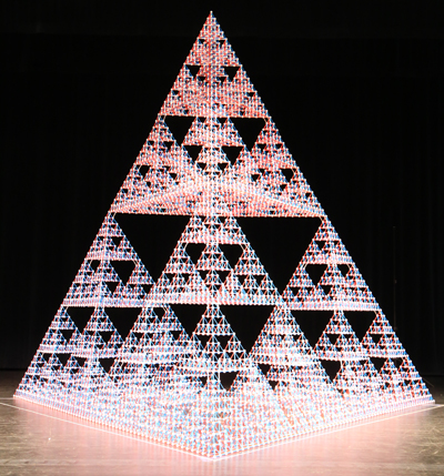 With theater spotlights illuminating the structure from above, the Sierpinski tetrahedron practically glows.