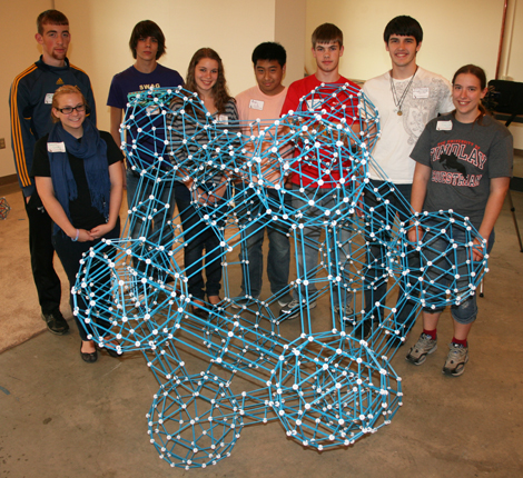 The students pose behind their completed project: a meta-icosahedron.