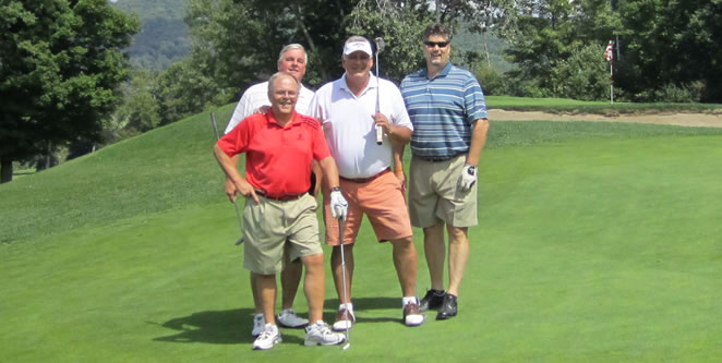 Pictured below: Don Eichenauer, '76; Bob Jordan, '75; Al Wager, '05; and Dennis Elsenbeck on the greens at the 2014 Holiday Valley Golf Outing.