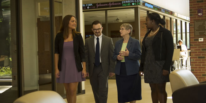 Pictured: Students with the President Carney in the Swan Business Center