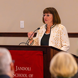 Carol Schumacher, Class of 1978, at podium.