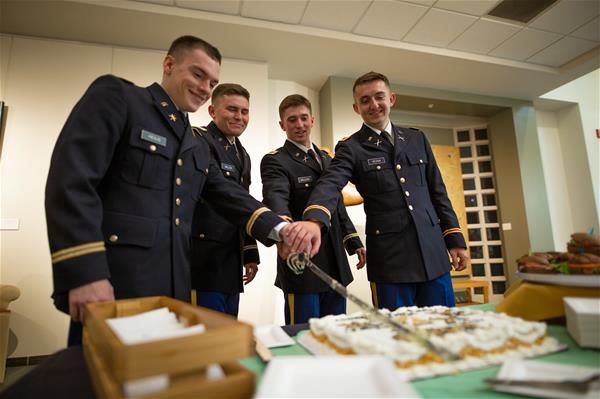 ROTC cadets cutting cake