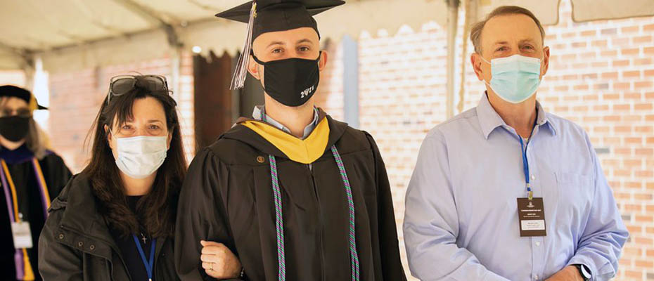 Graduate Justin Cyran with his parents