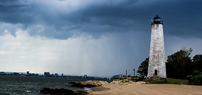 Lighthouse with a rainstorm in the background