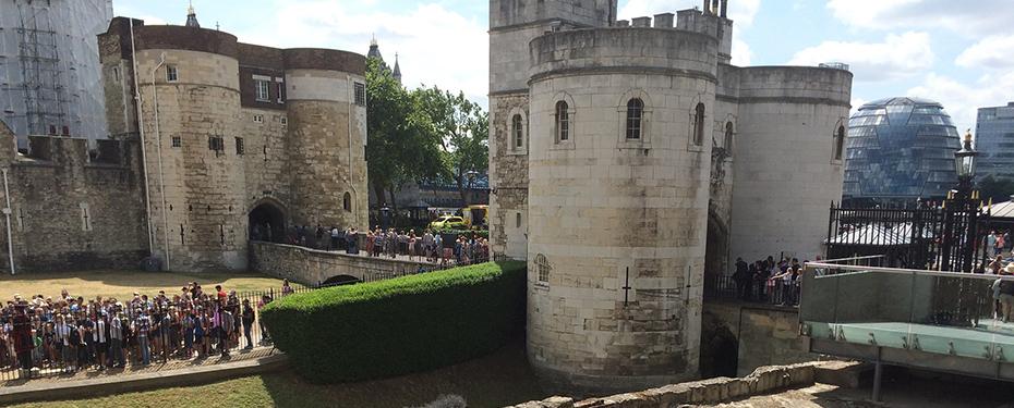 Visitors lined up outside a castle