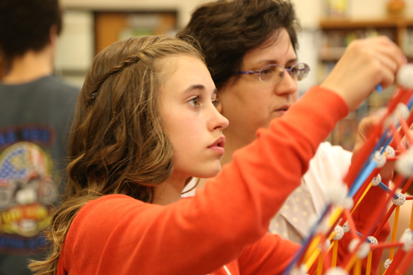 Chloee works alongside Mrs. Dodd-Nagel.