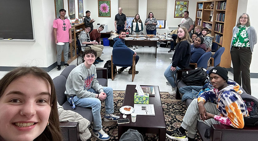 Students and faculty at the pizza party in the Math Suite