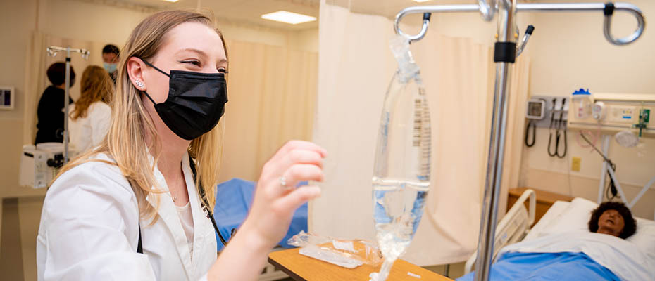 A nursing student in a simulated care station