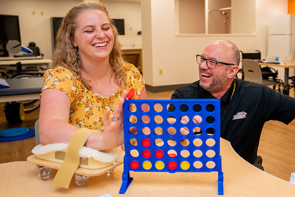 Behavior and social Instructor and client laughing