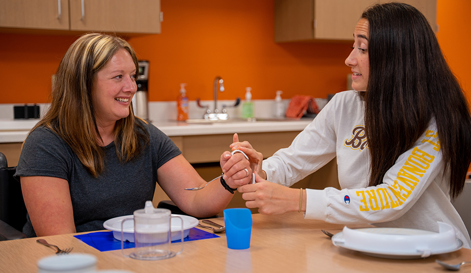 OT home page photo hand assist Patient receives hand therapy