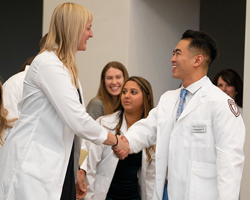 White coat handshake