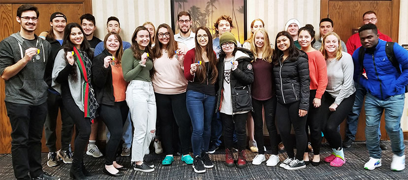 Members of the SBU Model UN pose with their awards at the 2019 Lake Erie International Model United Nations competition.
