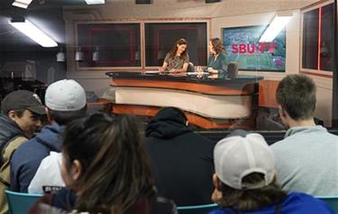 commday News anchors at the SBU TV Studio news desk