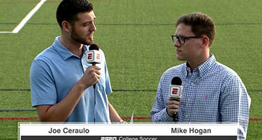 Two students on the soccer field doing a live broadcast for ESPN+ 
