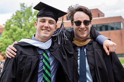 Grad studies Two students at Commencement