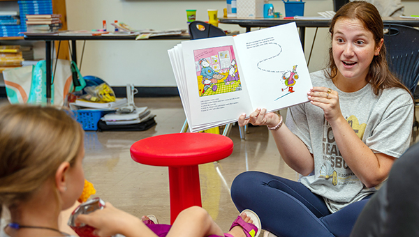 St. Bonaventure University literacy student reading to child