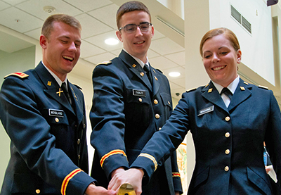 Three ROTC students at commissioning ceremonies