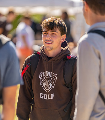 Three male students talking