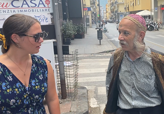 Elizabeth Egan conducts street interview in Italy