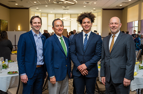 Pictured (from left): Dean David Hilmey, Les Quick III, Deandre Allen and President Jeff Gingerich