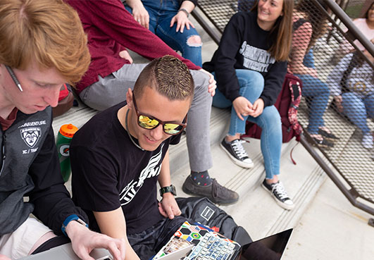 Students on steps of Plassmann Hall