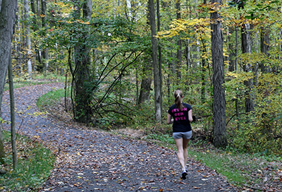 Student running the Allegheny River Valley Trail