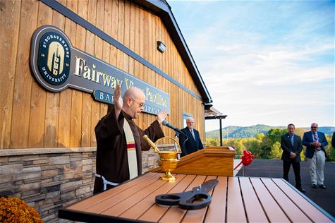 Fr. Ross Chamberland blesses the Pavilion.