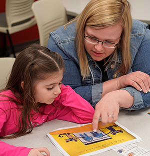 Literacy_InformationSession Reading Teacher and student