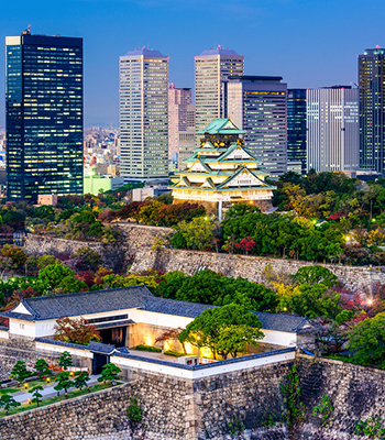 Osaka Castle, built in the 16th century, surrounded by modern skyscrapers.