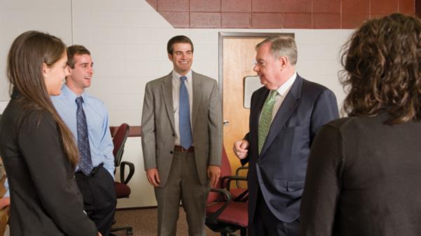 Gene McQuade chatting with accounting majors