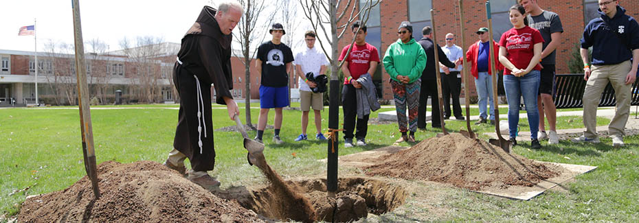 Students gathered for a tree planting ceremony on campus