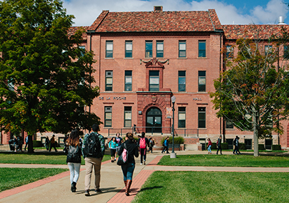 Students walking across campus 