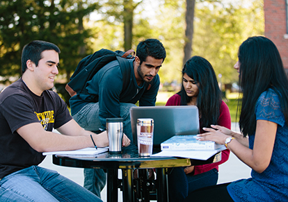 Students studying outside the Swan Business Center