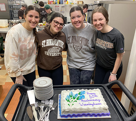 WH Anniversary cake and students
