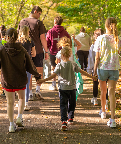 Bona Buddies on a walk in the woods on campus