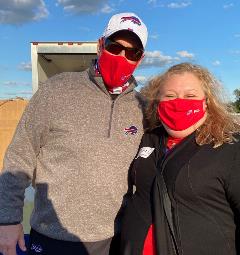 Buffalo Bills Jim Kelly and 1999 Bona grad Donna Quigley at the Huddle for Hunger food drive at Bills Stadium