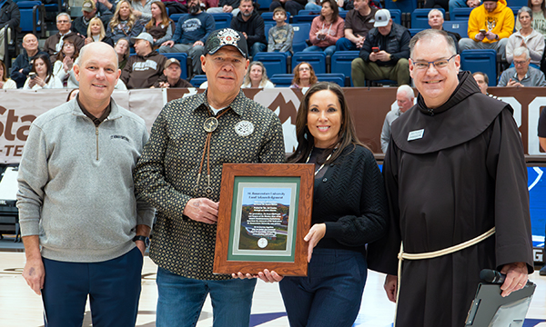 Dr. Gingerich, President JC and Nicole Seneca, and Fr. Stephen Mimnaugh