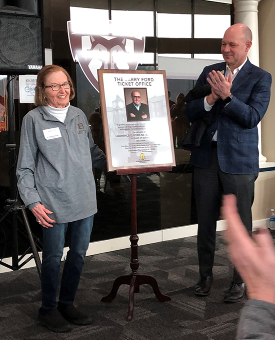 Sue Ford with President Gingerich and the plaque