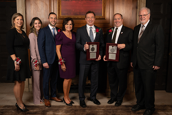 From left: Timea, Emily, Luke, Patricia and Gary Marchiori, Dave Whalen, and Dr. Joseph Zimmer, SBU president. 