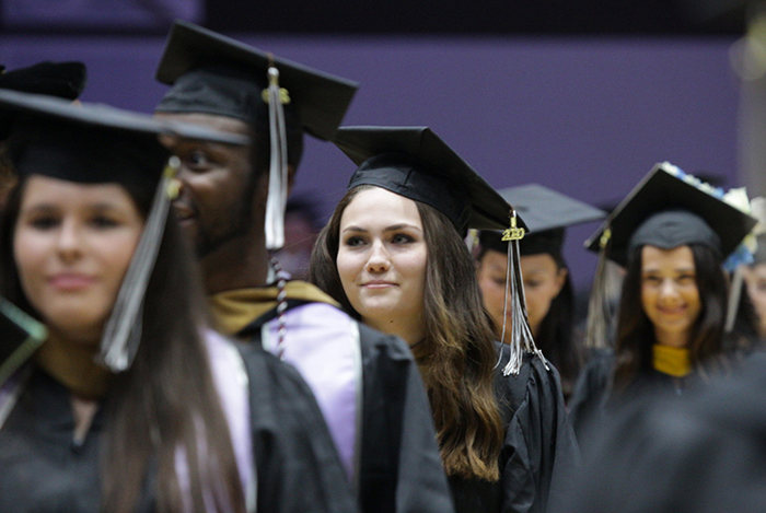 Class of 2020 grads process into the Reilly Center