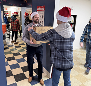 Dr. Dave Hilmey helps students in the box brigade.