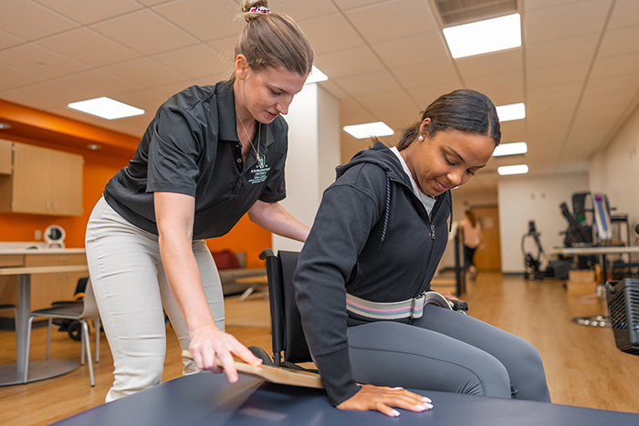 SBU Occupational Therapy students practice functional transfers during a skills lab. SBU Occupational Therapy students practice functional transfers during a skills lab.