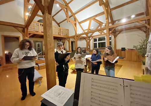 Student singers rehearse in the chapel at Mt. Irenaeus