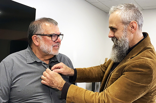 Rich_Lee_and_Scott_Sackett web Scott Sackett (right) adjusts Dr. Richard Lee’s microphone during a rehearsal for their Sunrise podcast series.
