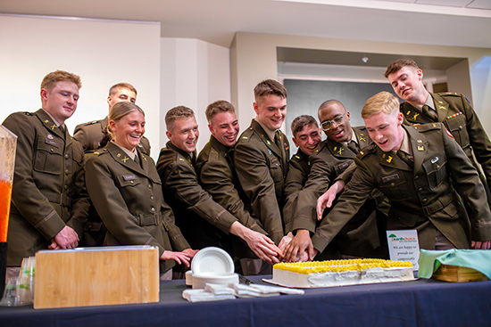 ROTC graduates cutting ceremonial cake