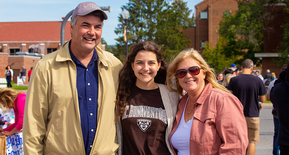 A St. Bonaventure University student and her parents enjoy Family Weekend.